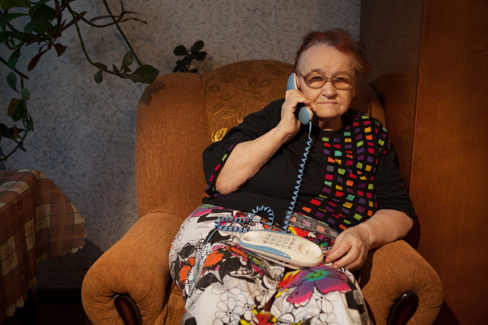 Elderly woman talking on the phone