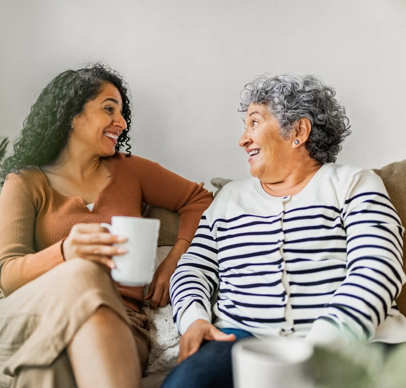 Elderly woman chatting with carer