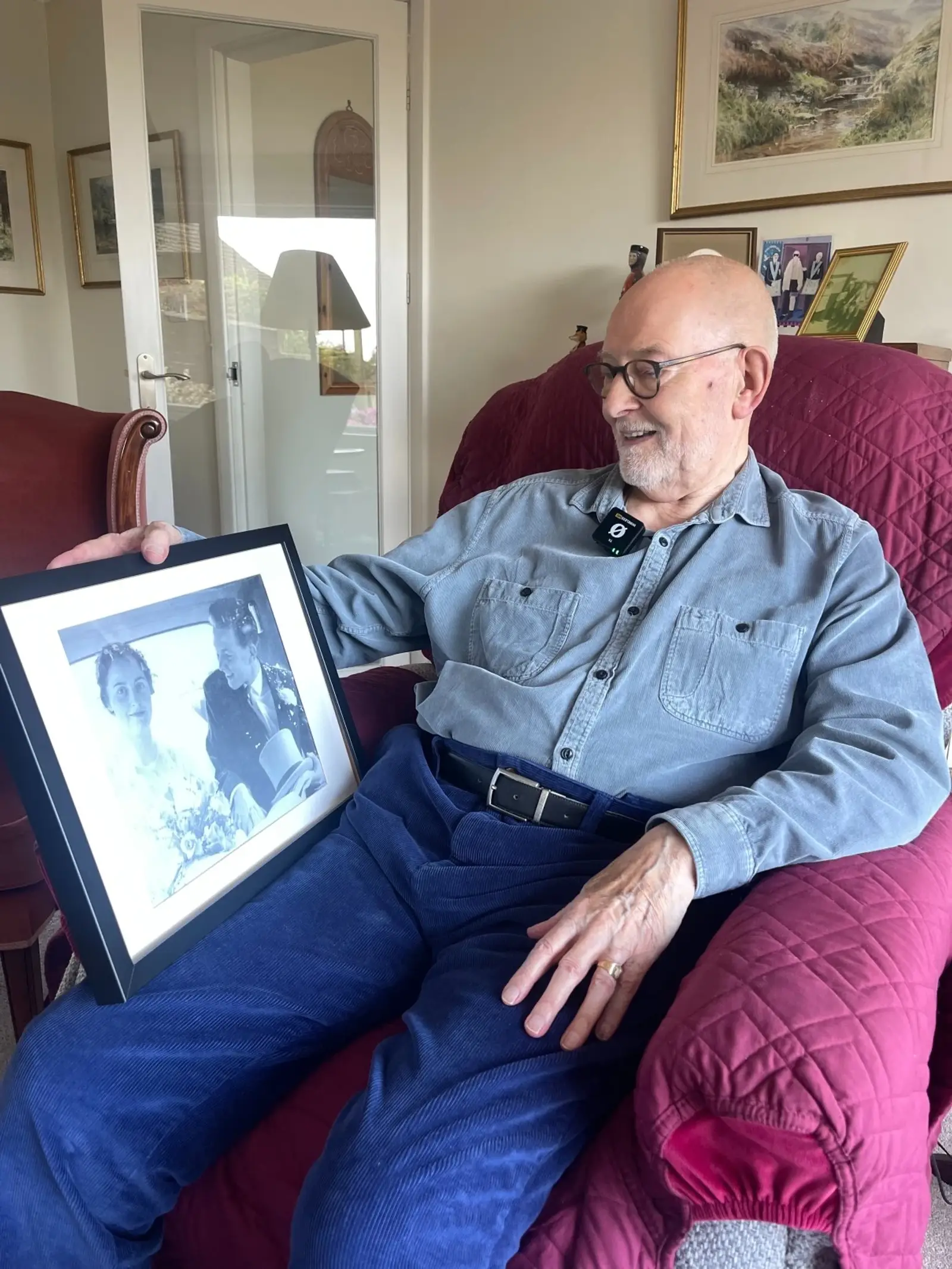 Mr Beard looking at his wedding photo