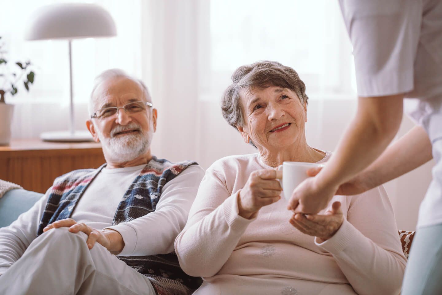 Elderly couple sitting on the sofa
