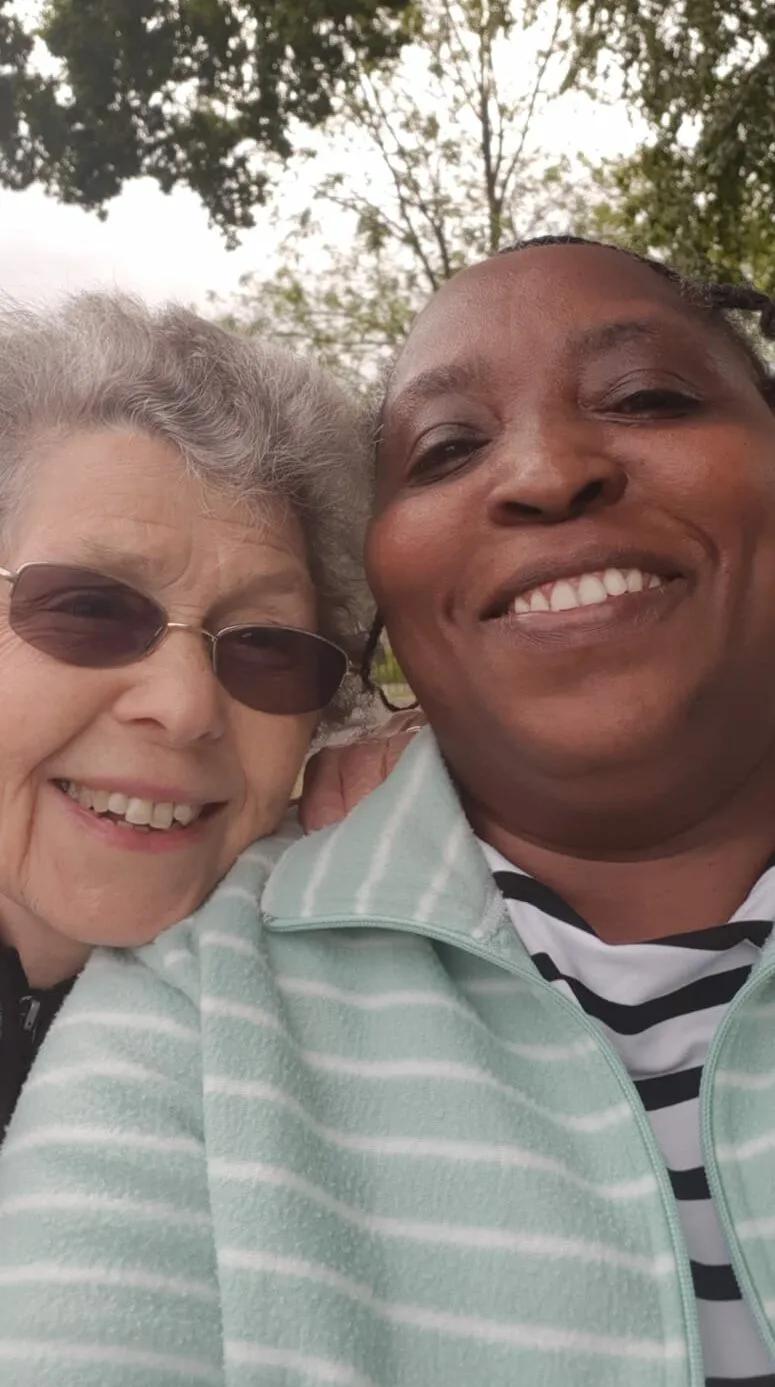 Patricia and her carer at the park