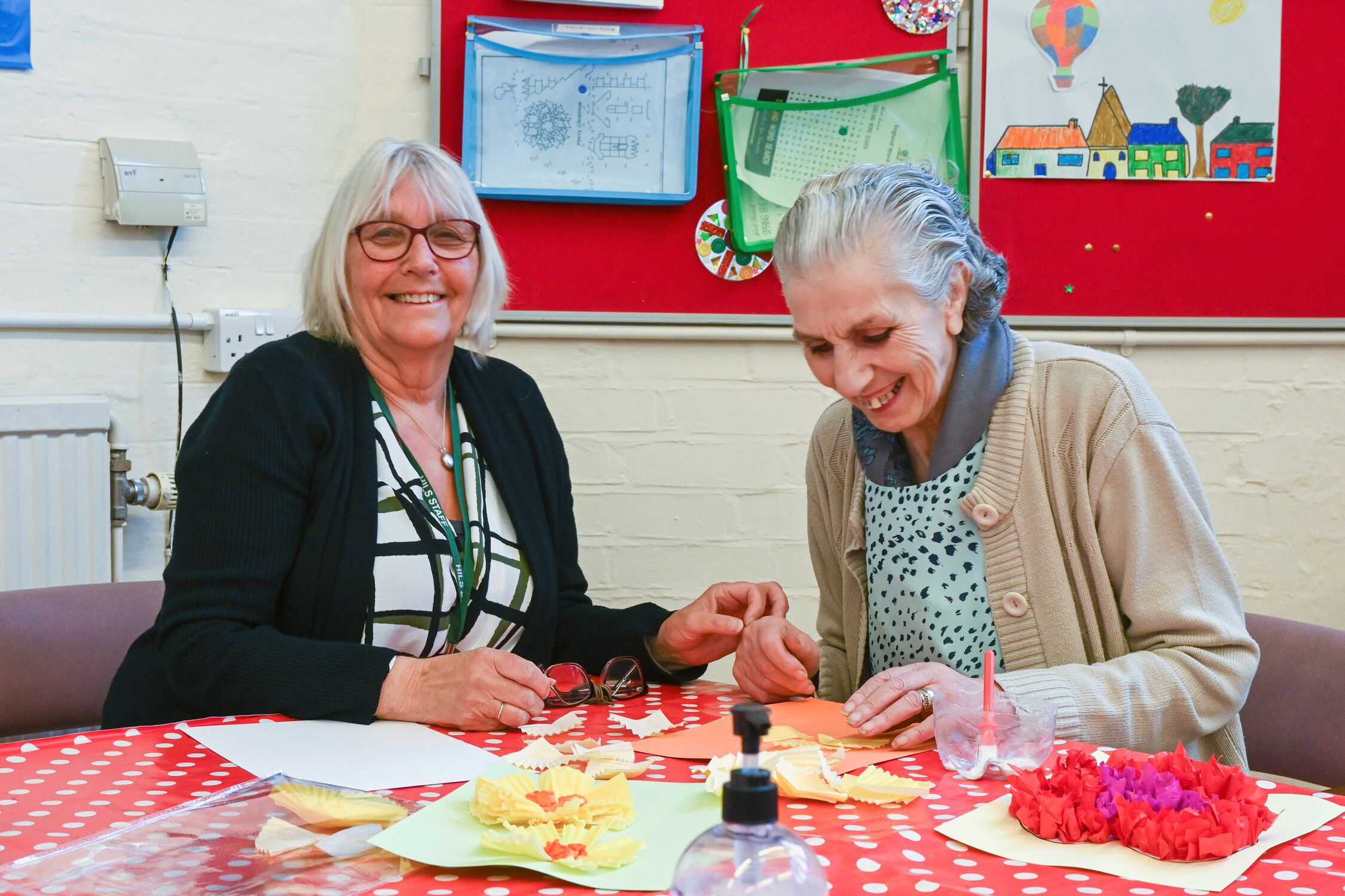 Two elderly women doing crafts