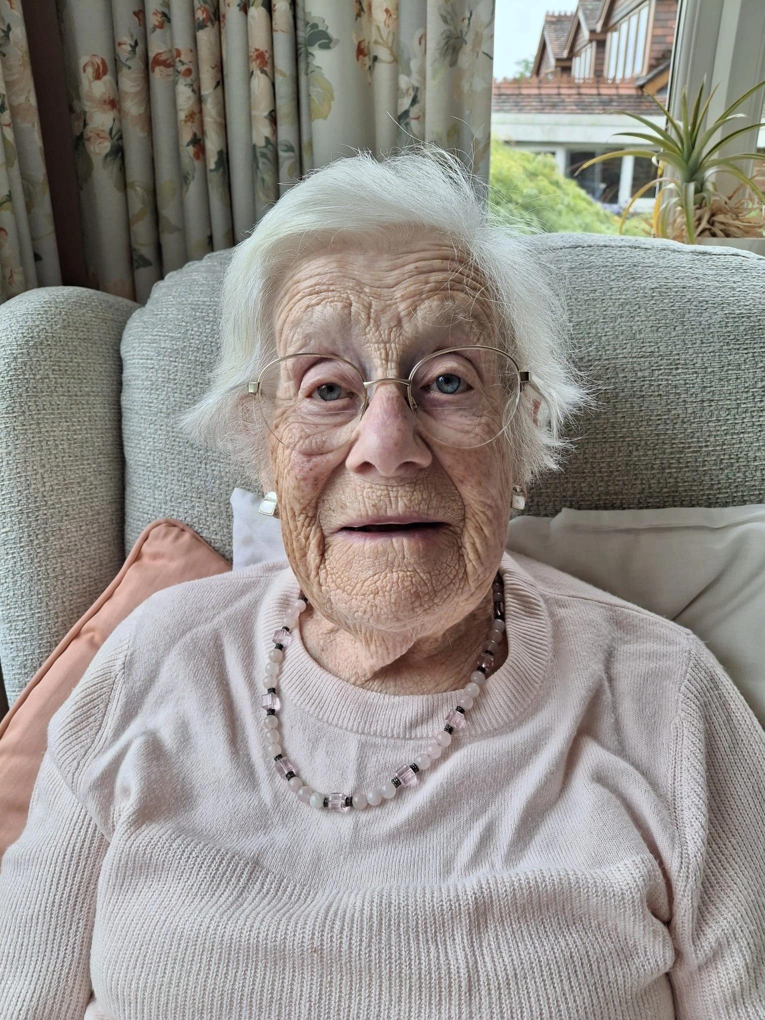 Pat sitting on the sofa