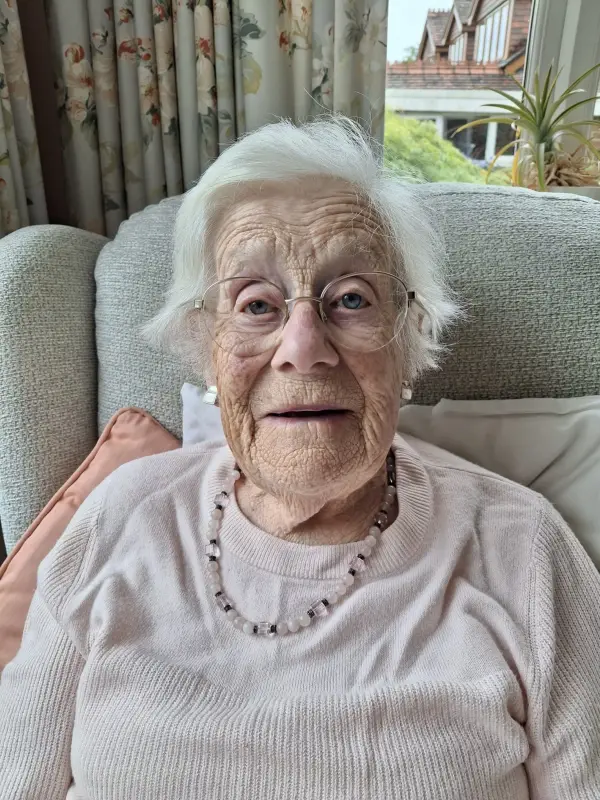 Pat sitting on the sofa