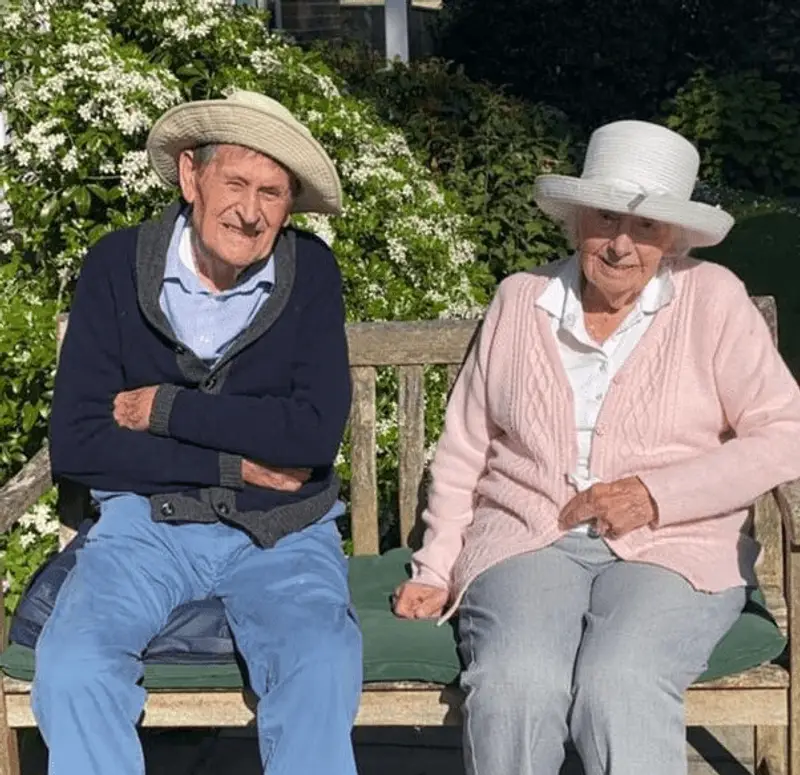 Jean and Frederick sitting on a bench