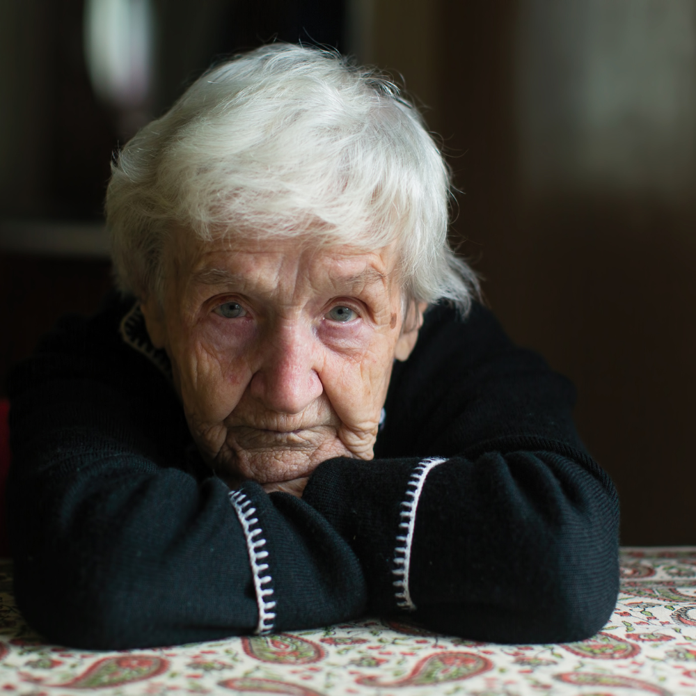 Elderly woman looking straight ahead
