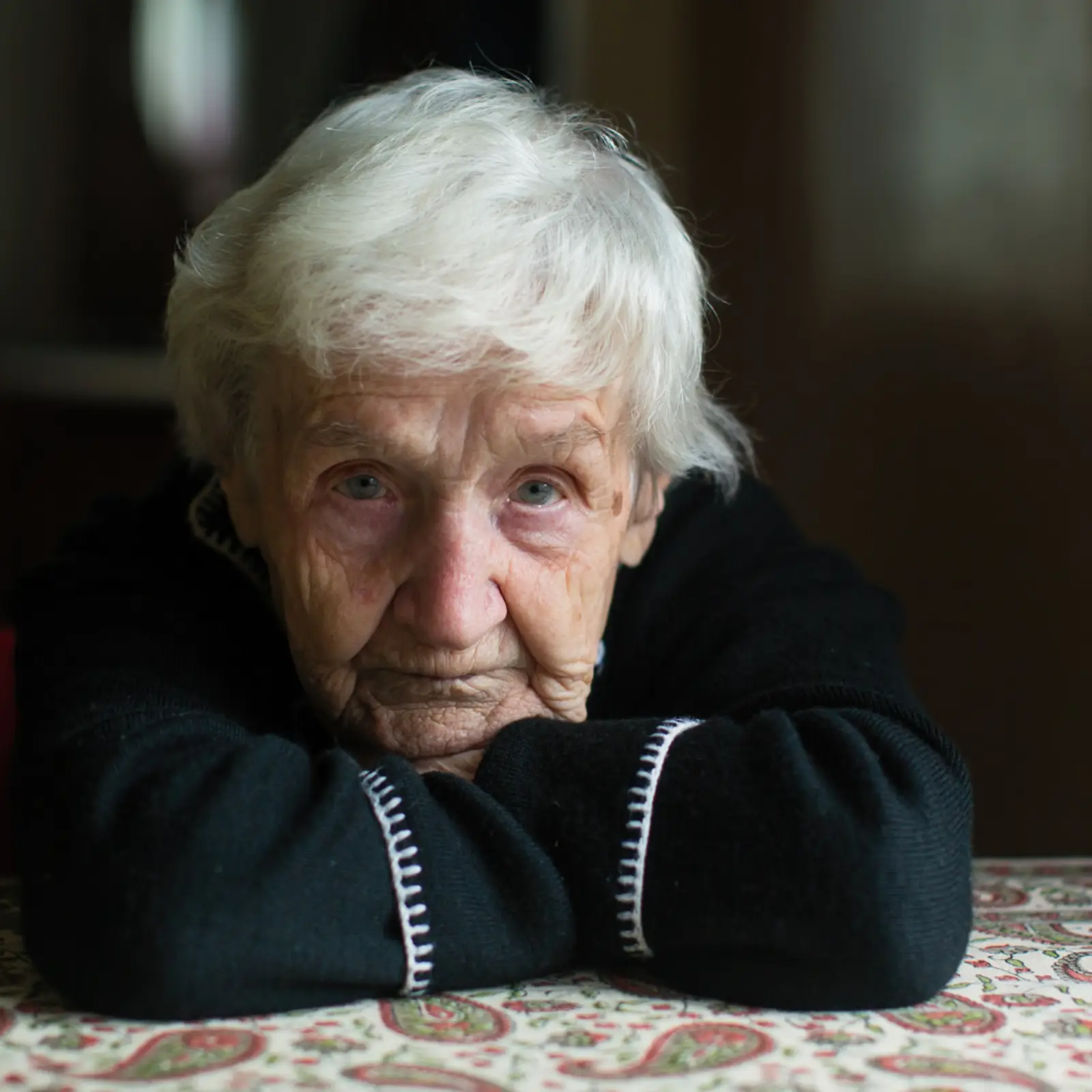 Elderly woman looking straight ahead
