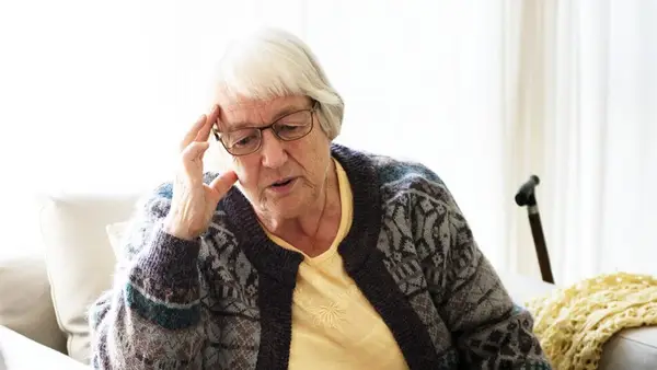 Older woman sitting in armchair