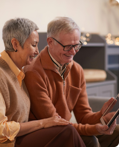A couple looking at a laptop screen