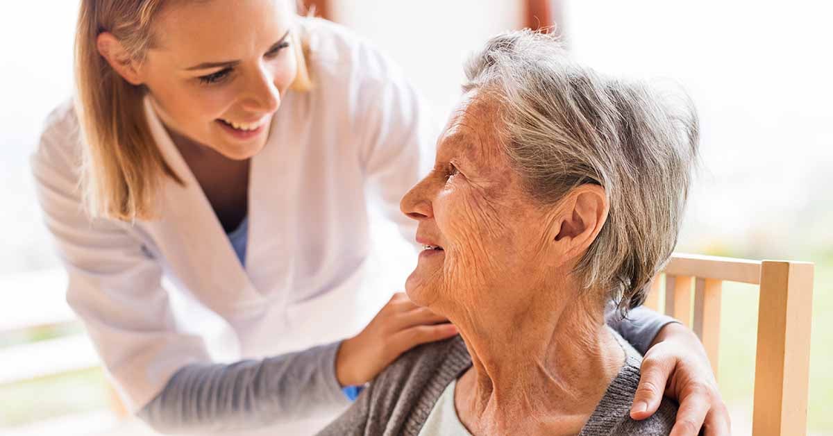 Elderly woman with her carer