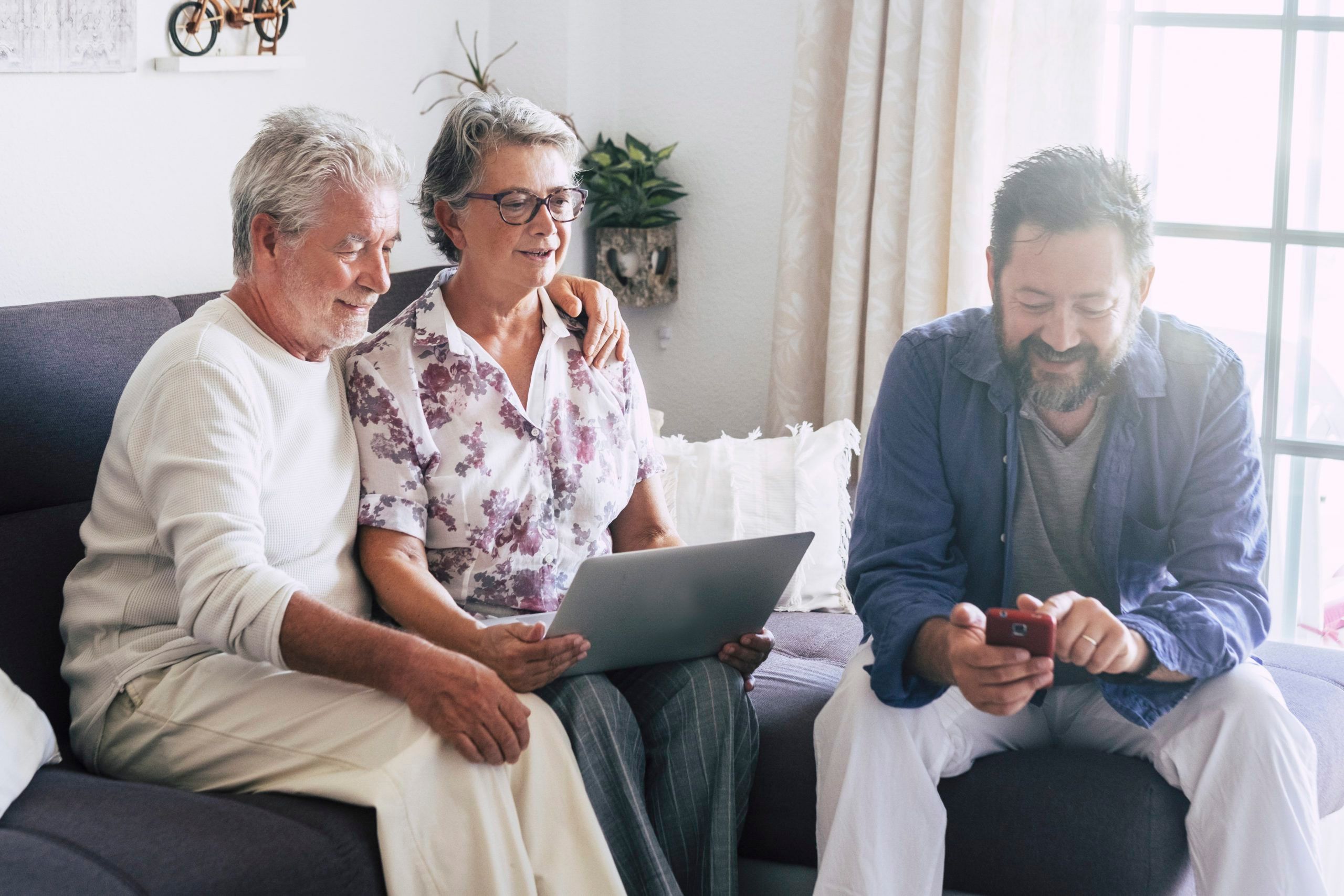 Three people using technology