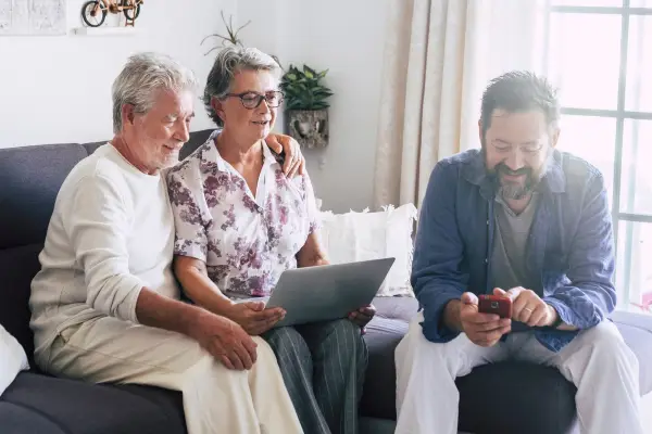Three people using technology
