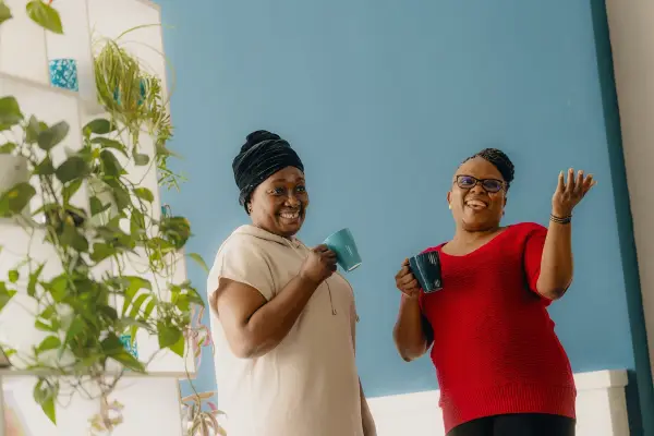 Two carers with a cup of tea