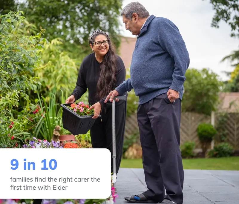 Elderly man with his carer in the garden