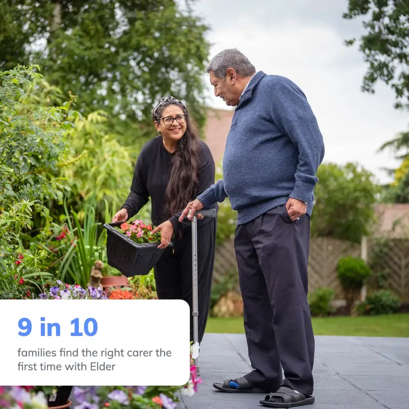 Elderly man with his carer in the garden