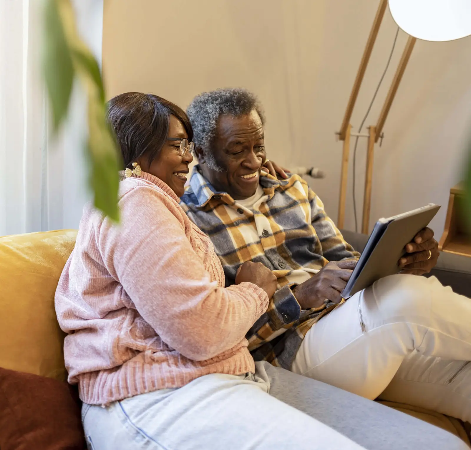 A carer at her computer writing notes