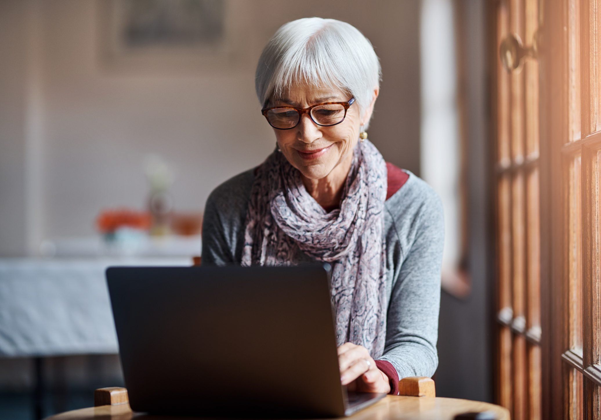 Elderly woman with laptop