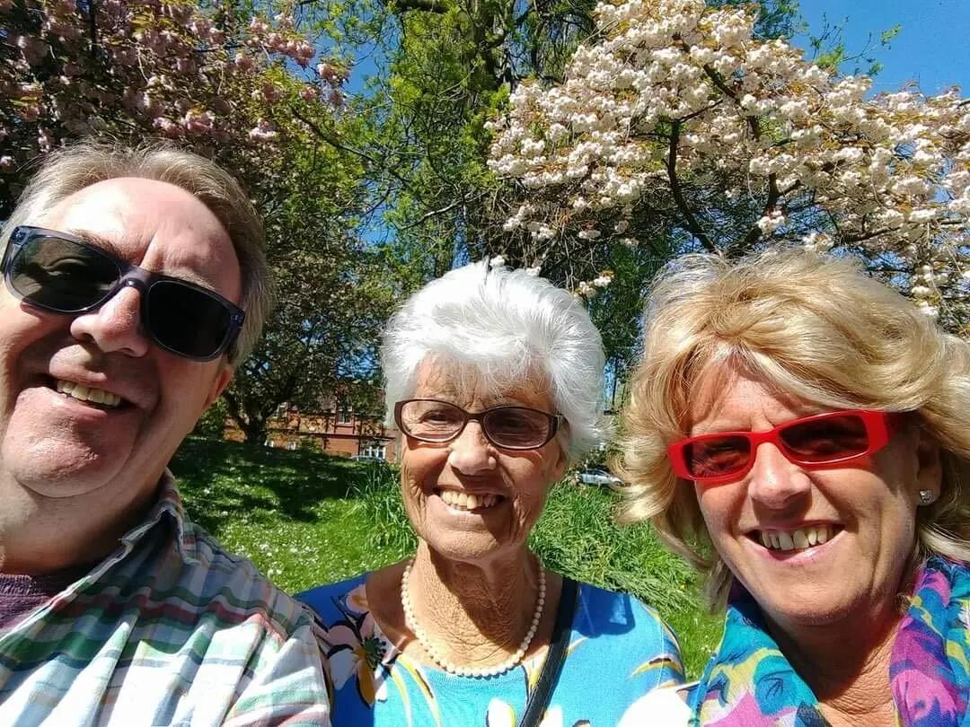 Sue with her mum and husband at the park