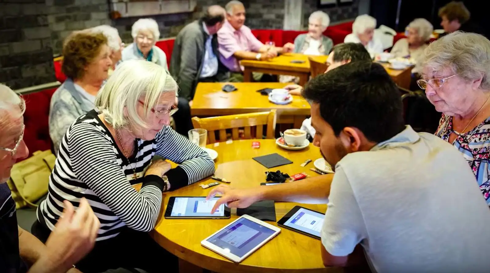 Dhruv Sharma at his PhD research intervention, helping older adults learn how to interact with video calling software.