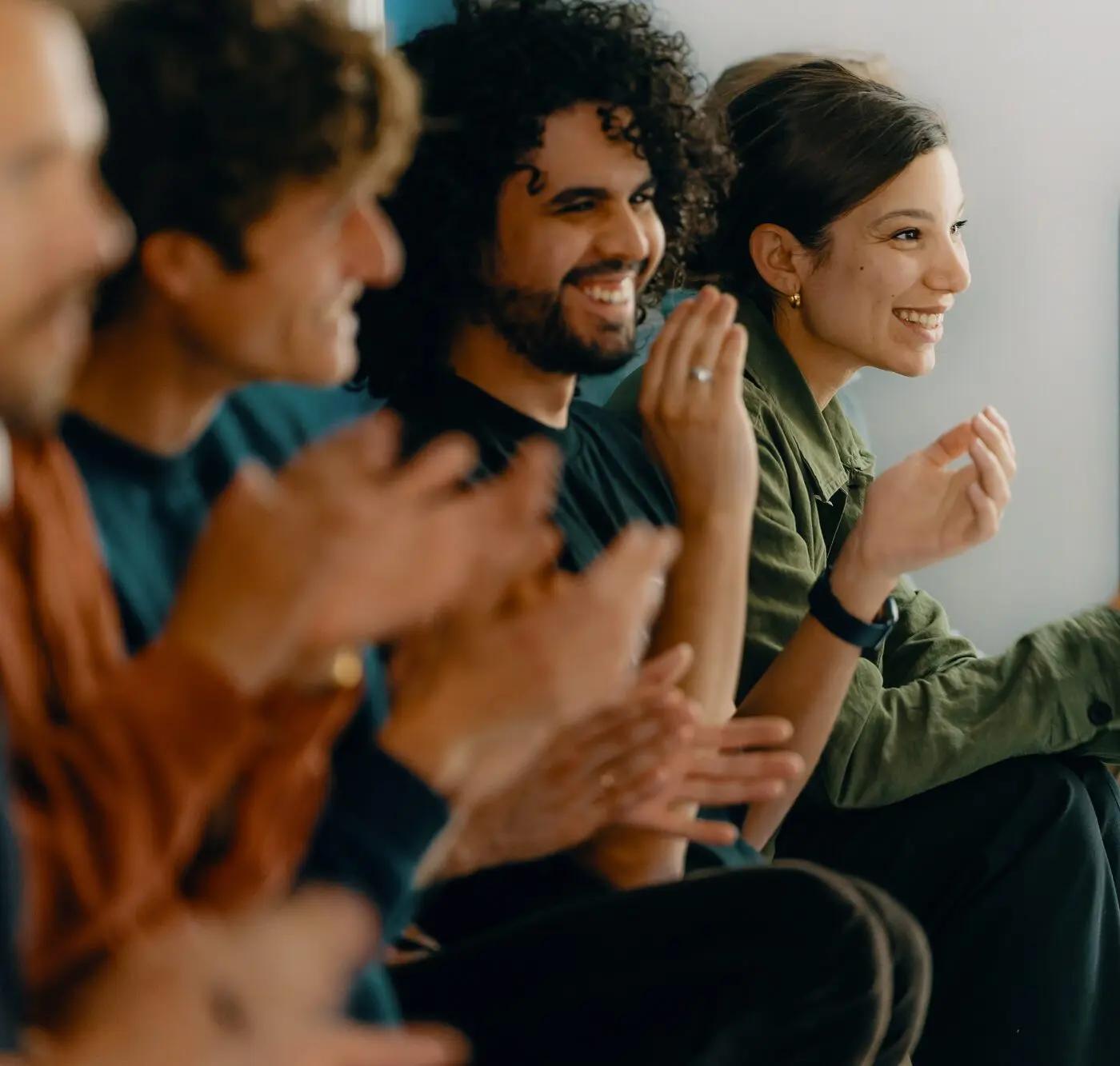 Elder employees clapping