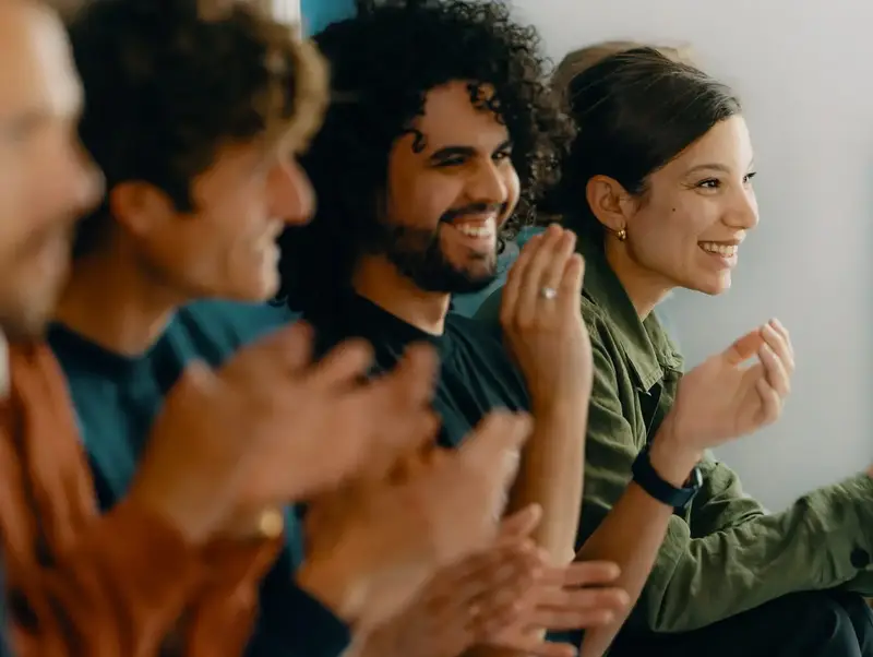 Elder employees clapping