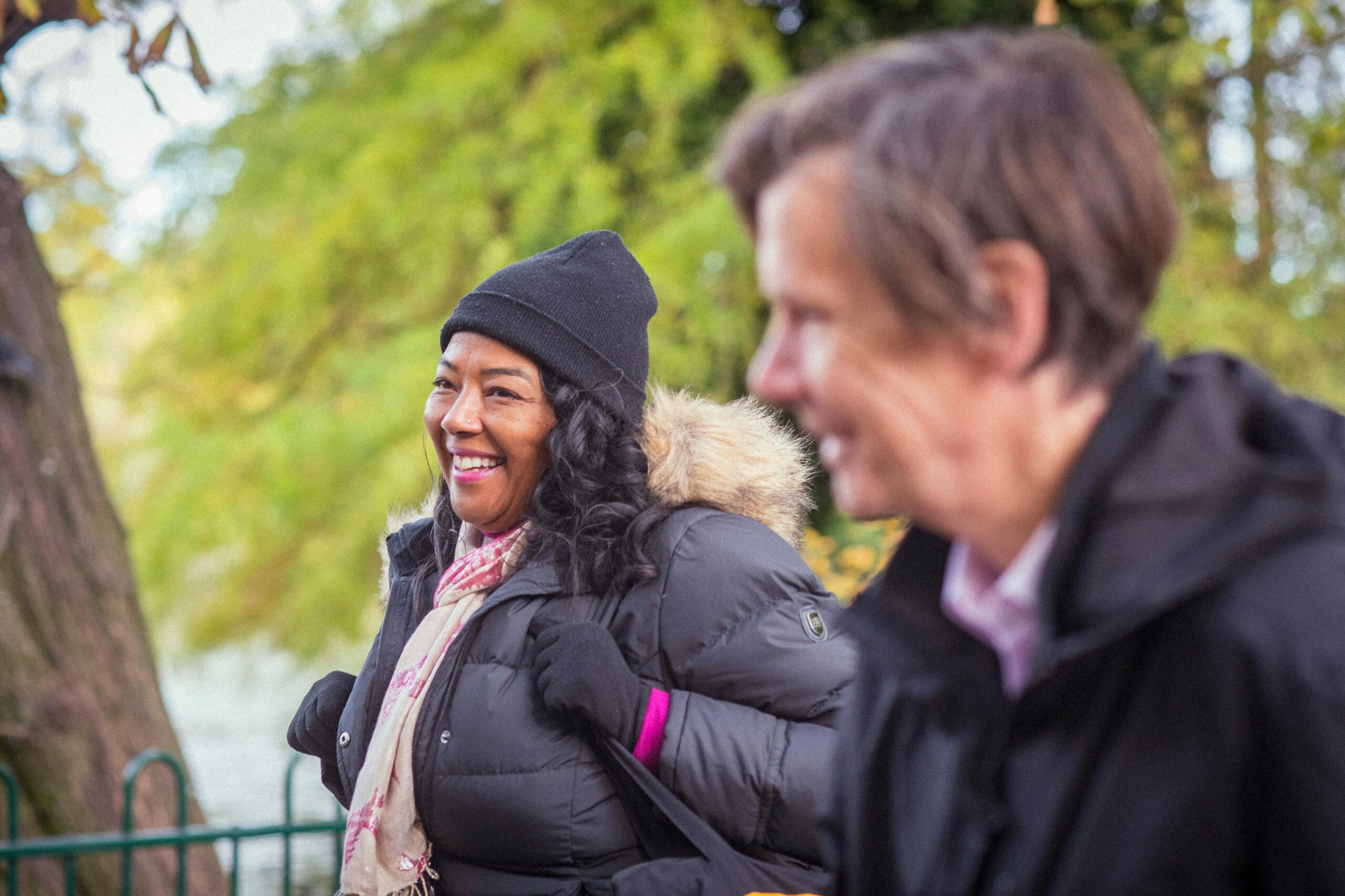 Elderly lady and carer going for a walk
