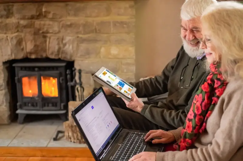 Older couple with laptop and tablet