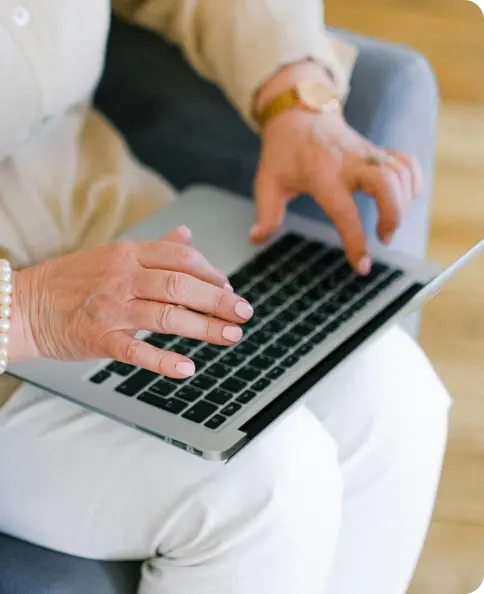 A couple looking at a laptop screen