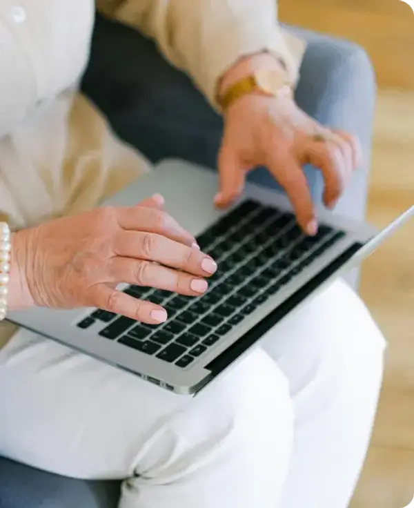 Woman typing on a laptop