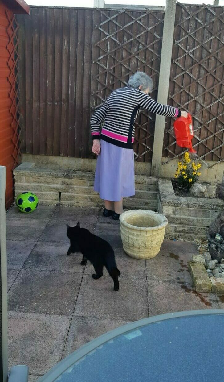 Patricia getting out in the garden with Adele