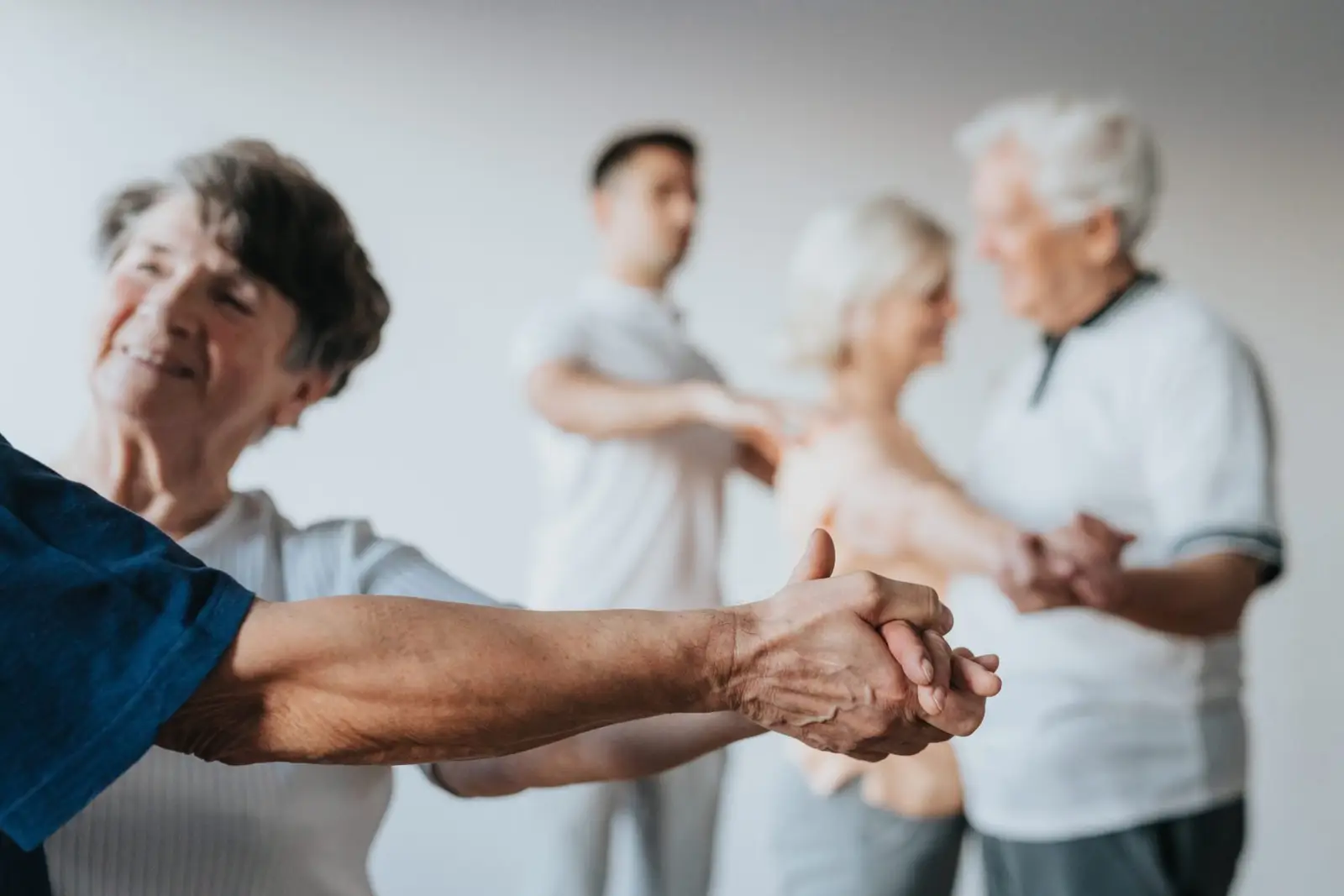 Several elderly couples dancing