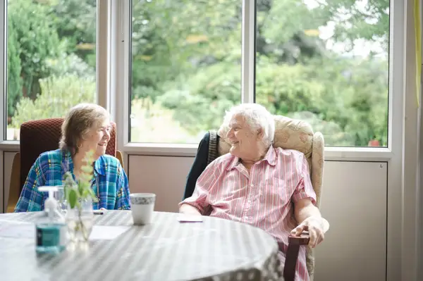 Two elderly people in a care home