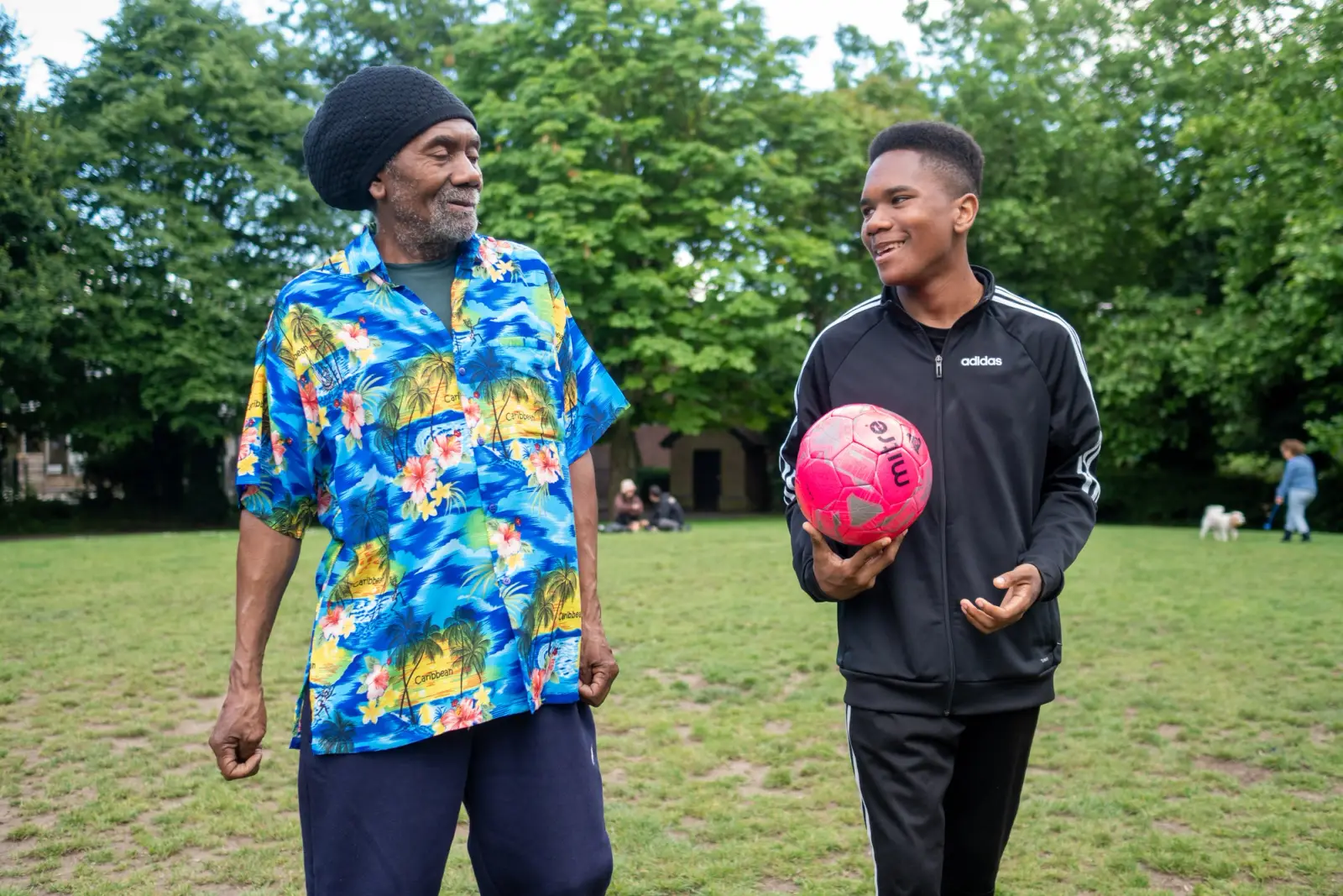 Two people playing football