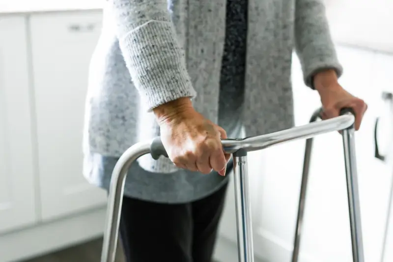 Elderly person with a walking aid