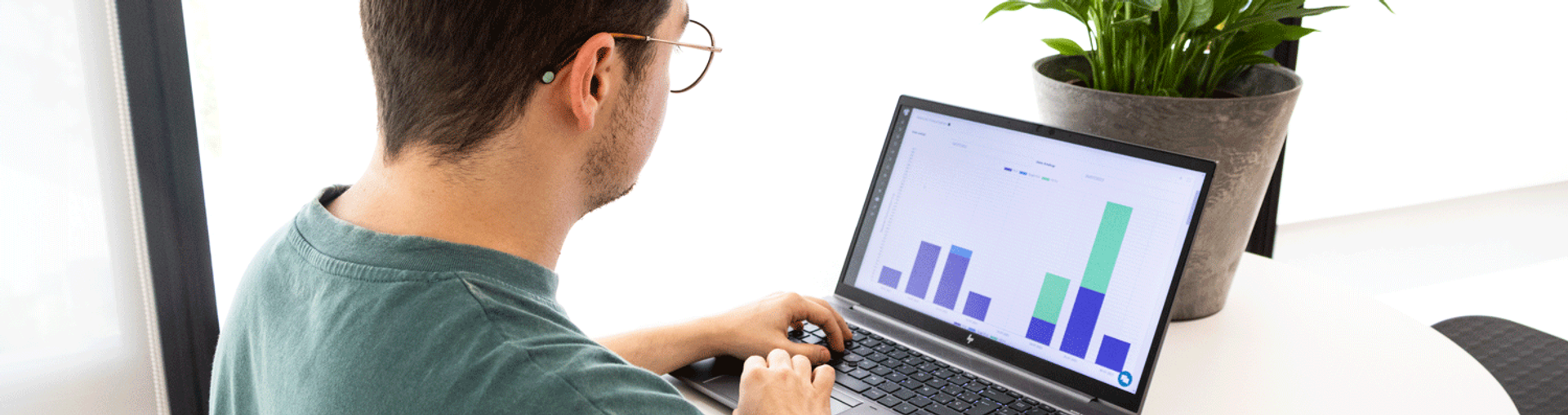 Worker looking at their printing analytics