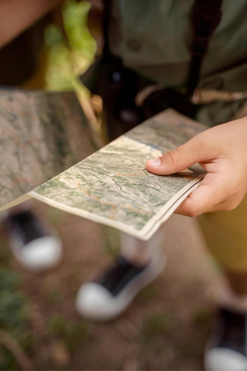 a child holds an adventure map