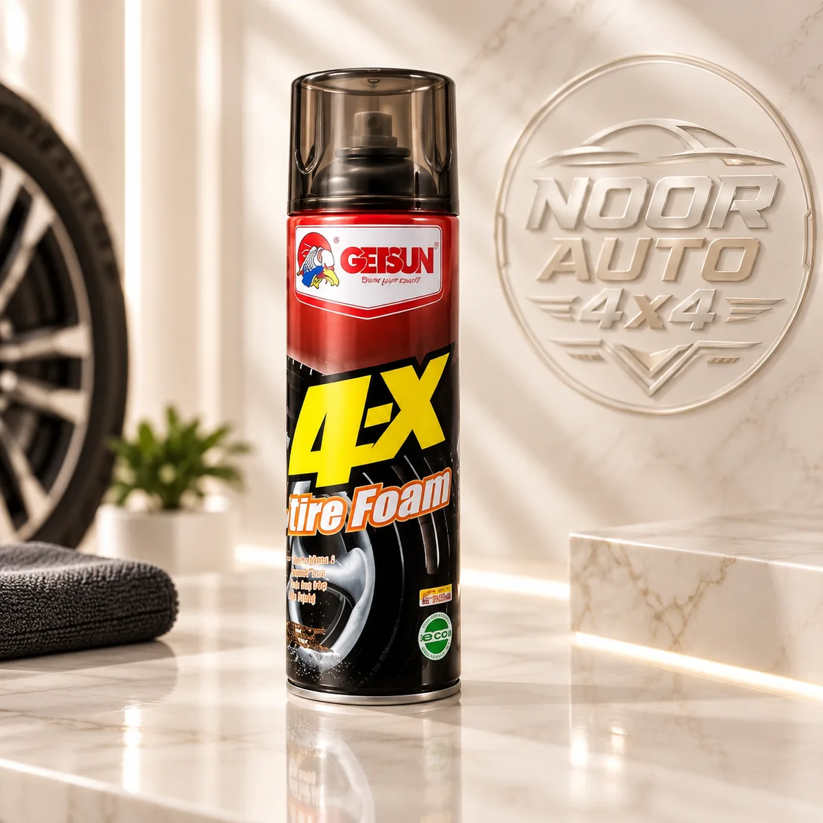 Getsun 4-X Tire Foam can beside an alloy wheel, angled view