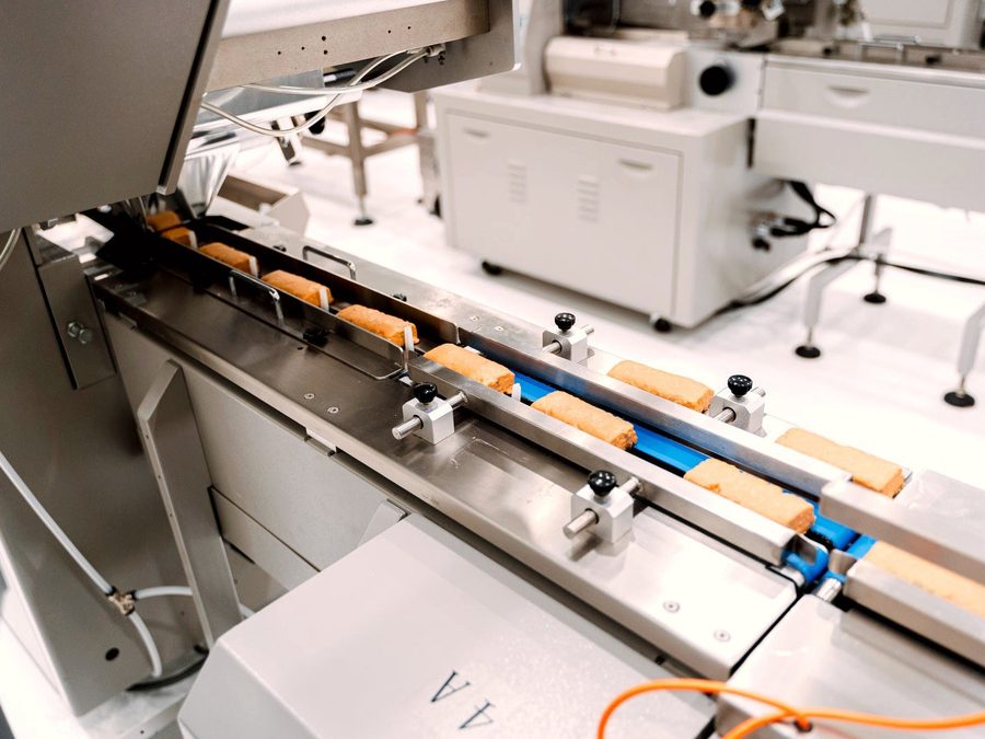 Bars entering the flow-wrap packaging line at Core Craft
