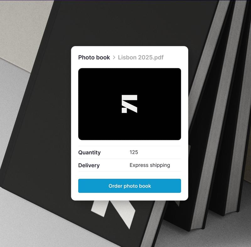 Photo book order card overlaying stacked black books, showing quantity 125, express shipping, and an order button.