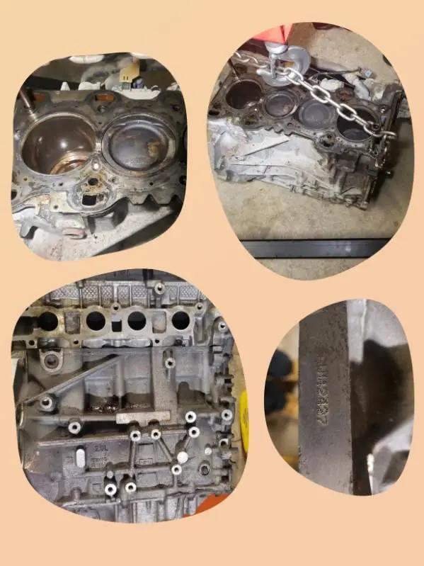 Disassembled engine block, cylinder head and pistons laid out for internal engine repair at Speedy Underhood Service in Columbus, Ohio