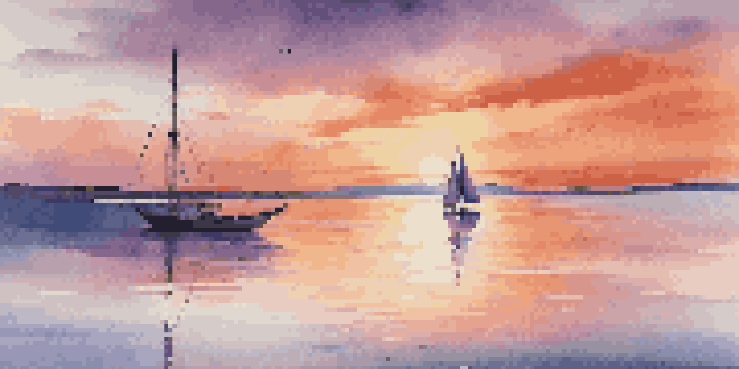 A calm sea at sunset with vibrant colors in the sky and a sailboat in the foreground.