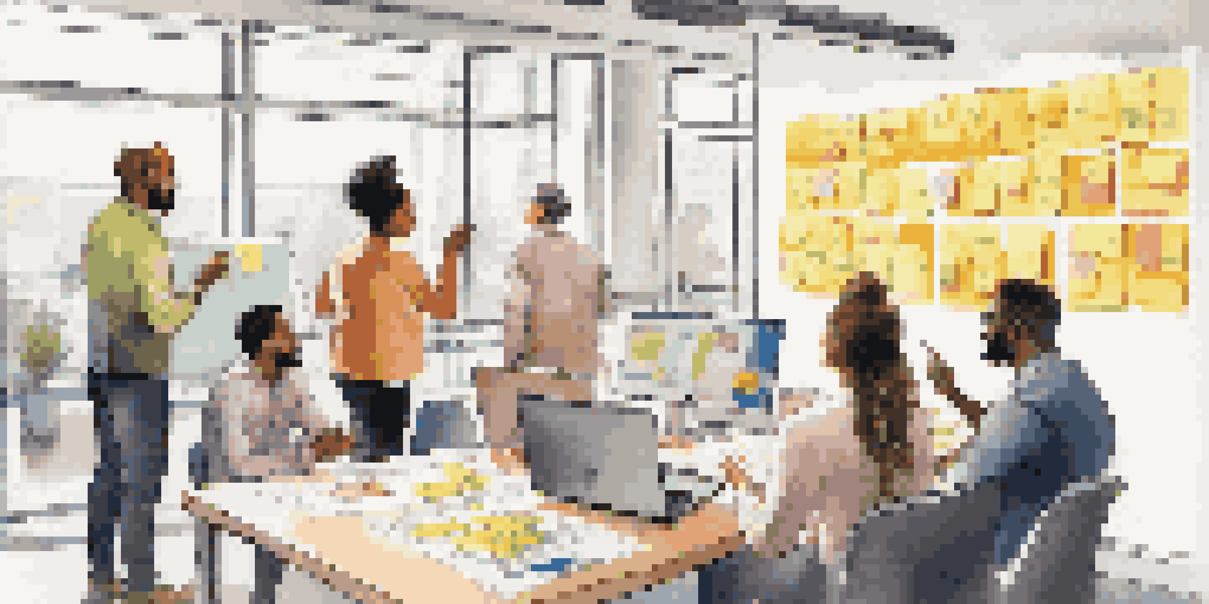 A diverse group of professionals collaborating in a bright office, surrounded by sticky notes and a whiteboard.