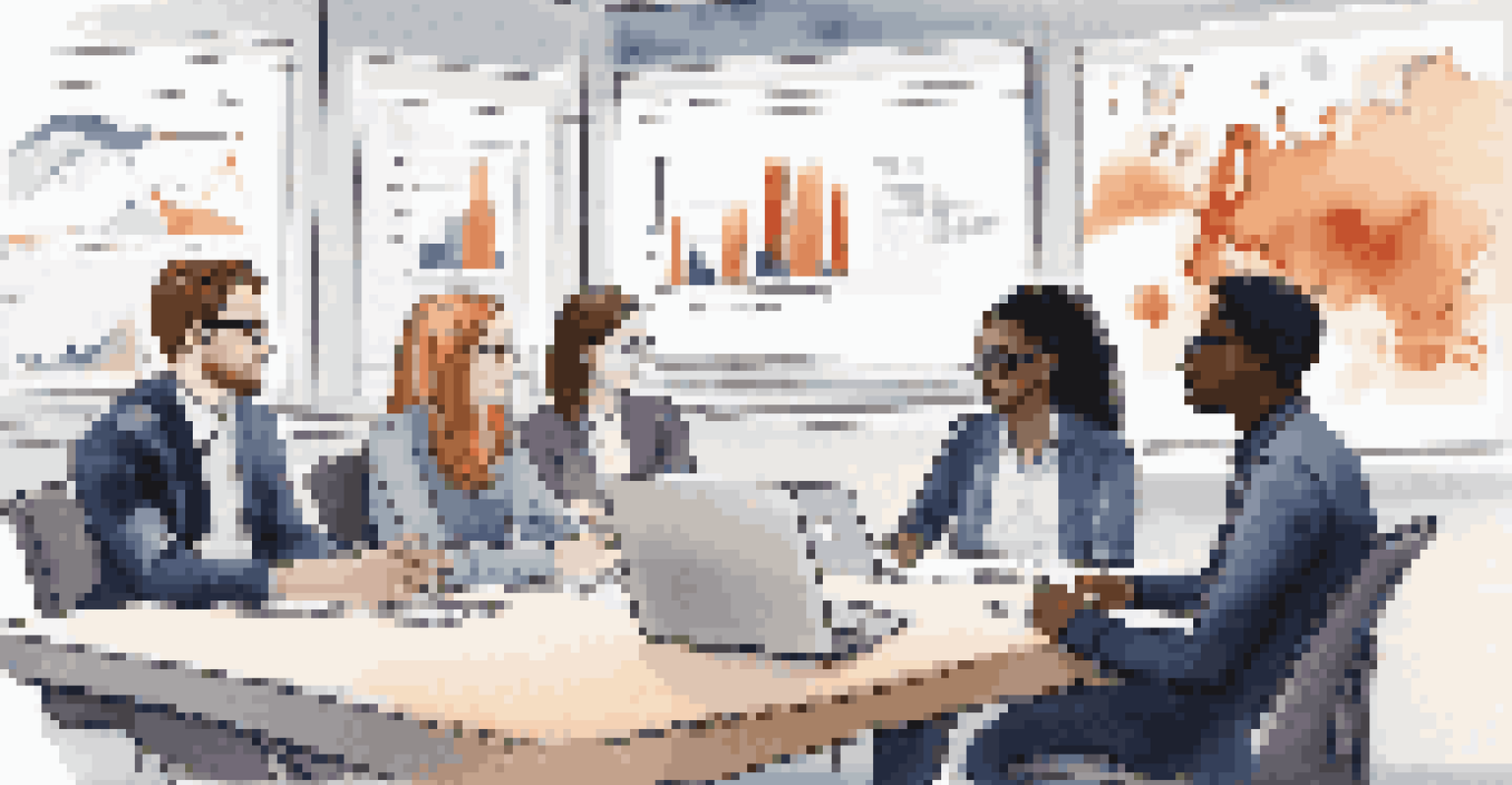 A diverse group of interns discussing around a conference table with laptops and screens showing data.