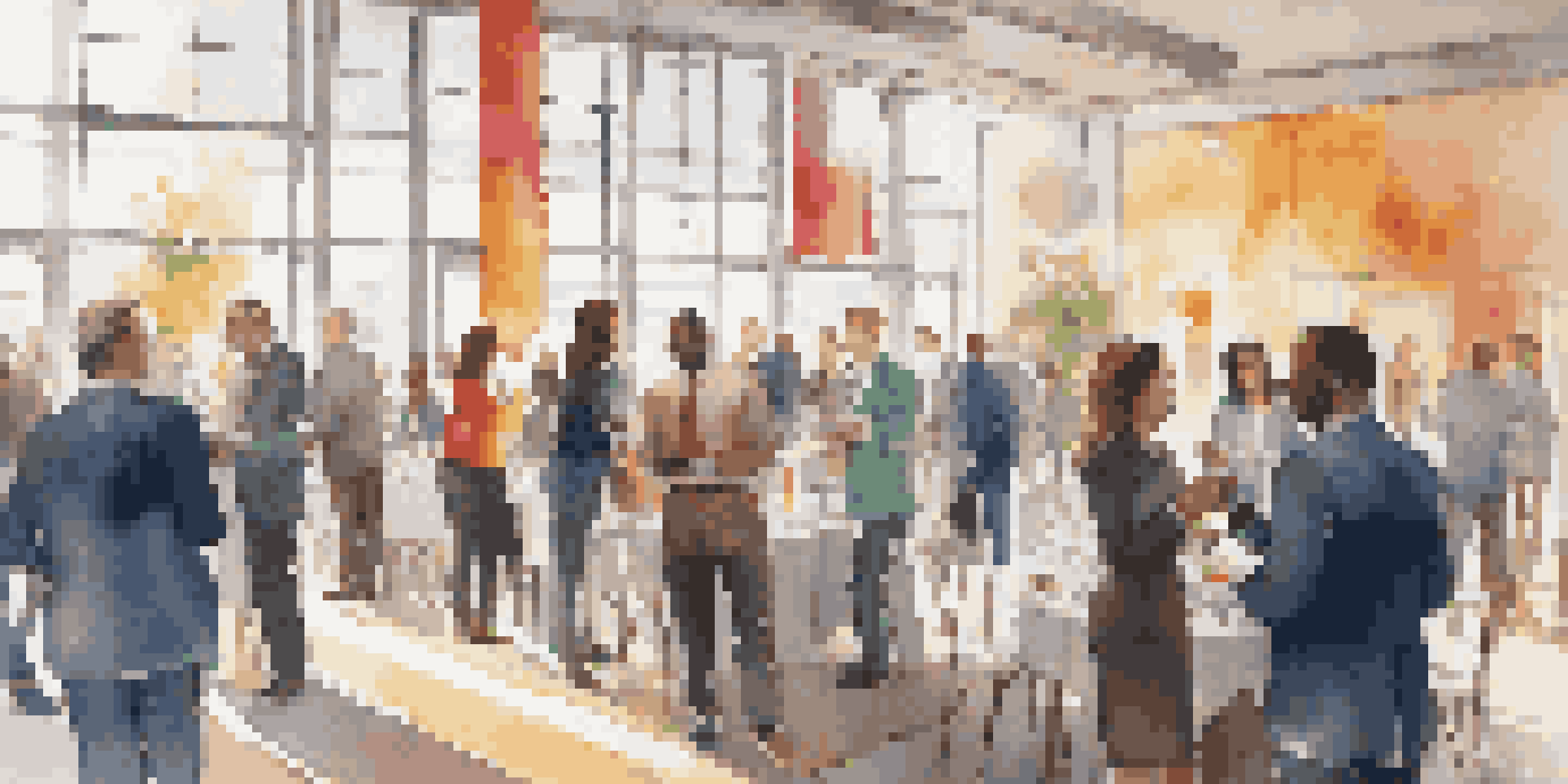 A person confidently networking at an event, surrounded by diverse individuals and bright, natural light.