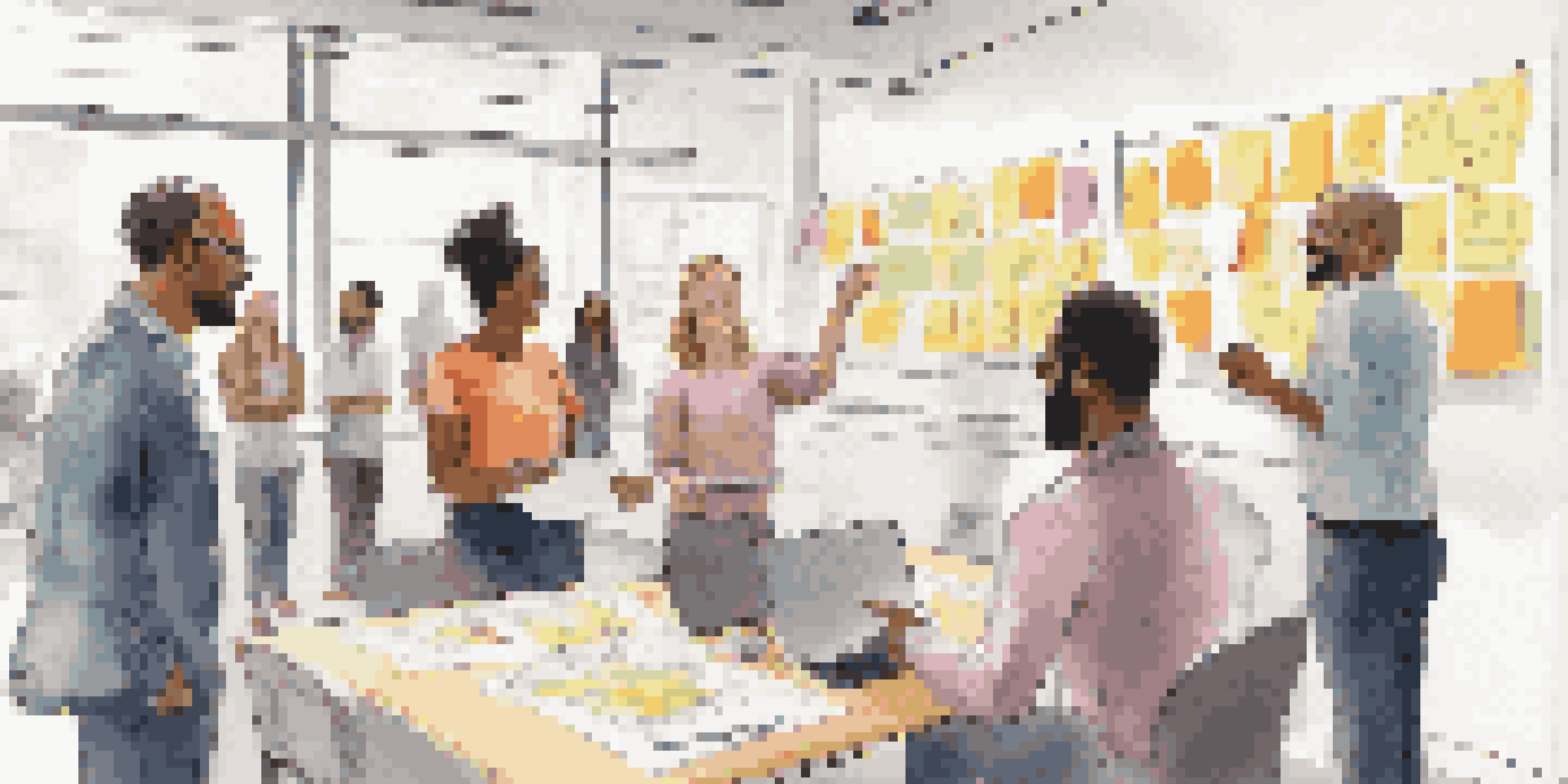 A group of diverse professionals in a bright meeting room discussing their project during a daily stand-up meeting, with colorful post-it notes on the walls.
