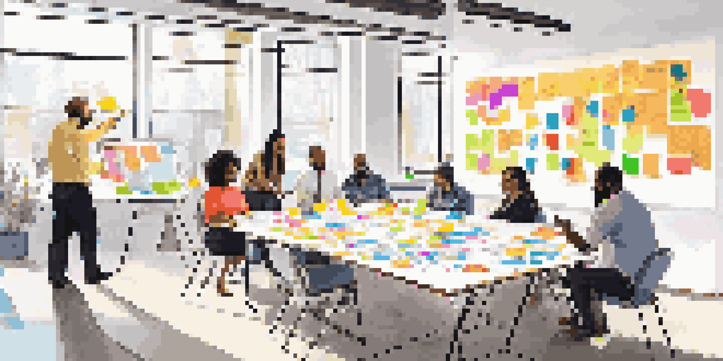 A lively workshop with diverse professionals engaged in brainstorming, surrounded by colorful sticky notes and a whiteboard filled with ideas.