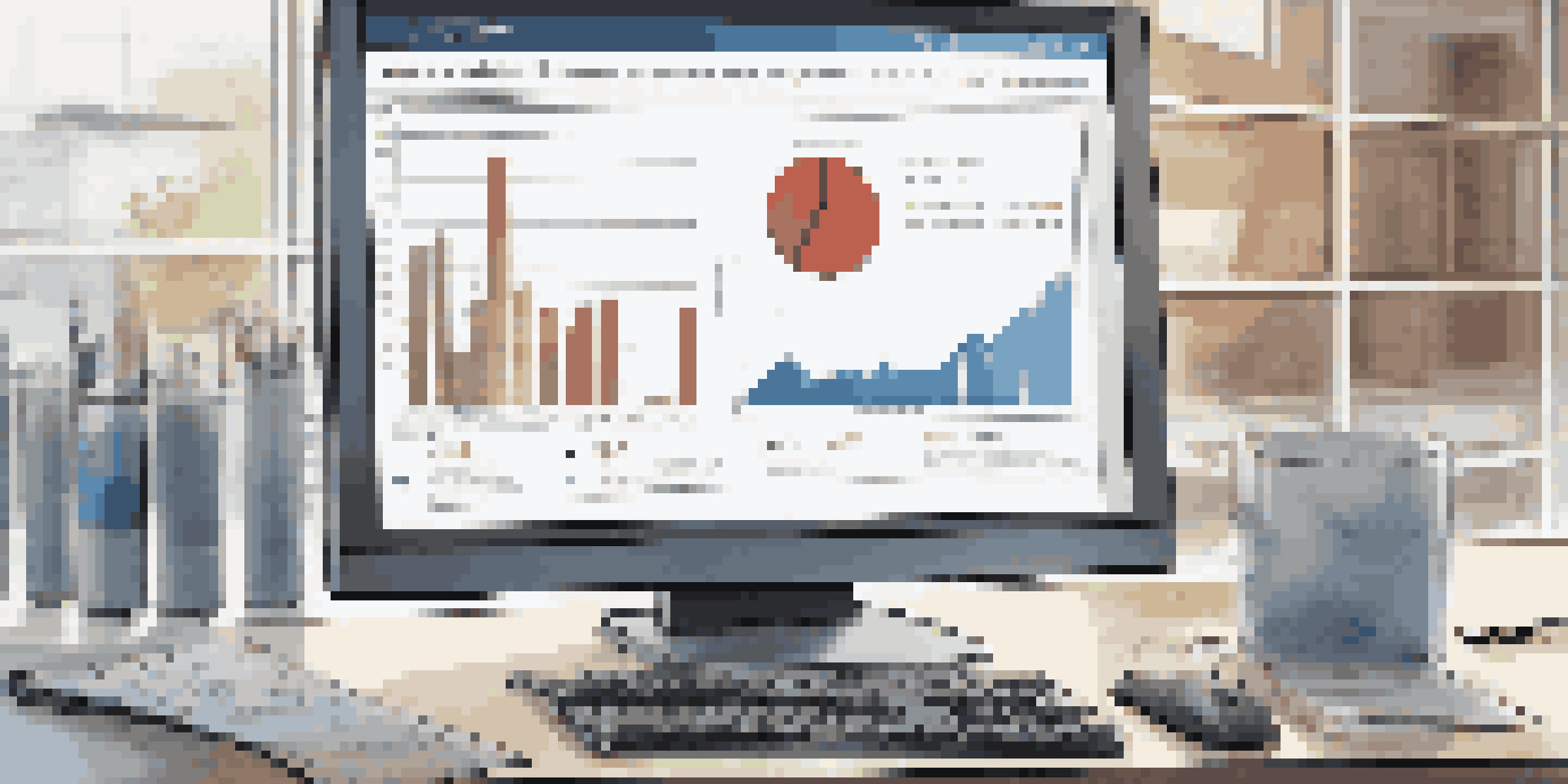 An analytical chart on a computer screen showing market trends and job postings in a modern office.
