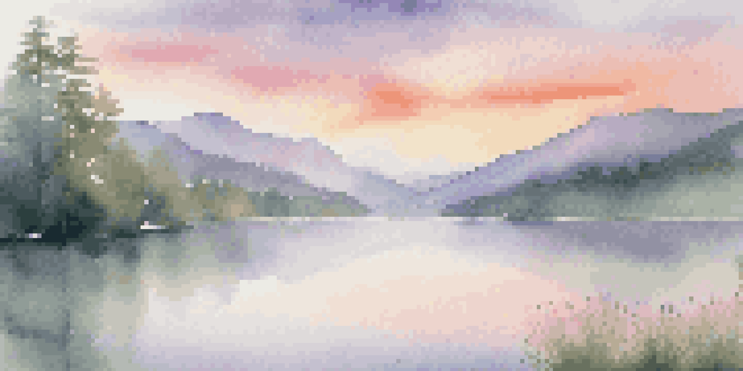 A beautiful sunrise over mountains, with colorful sky reflections on a calm lake surrounded by green trees.