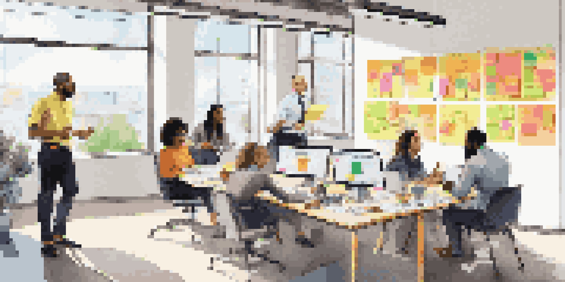 A diverse group of professionals in a bright office collaborating on ideas with colorful sticky notes on the walls.