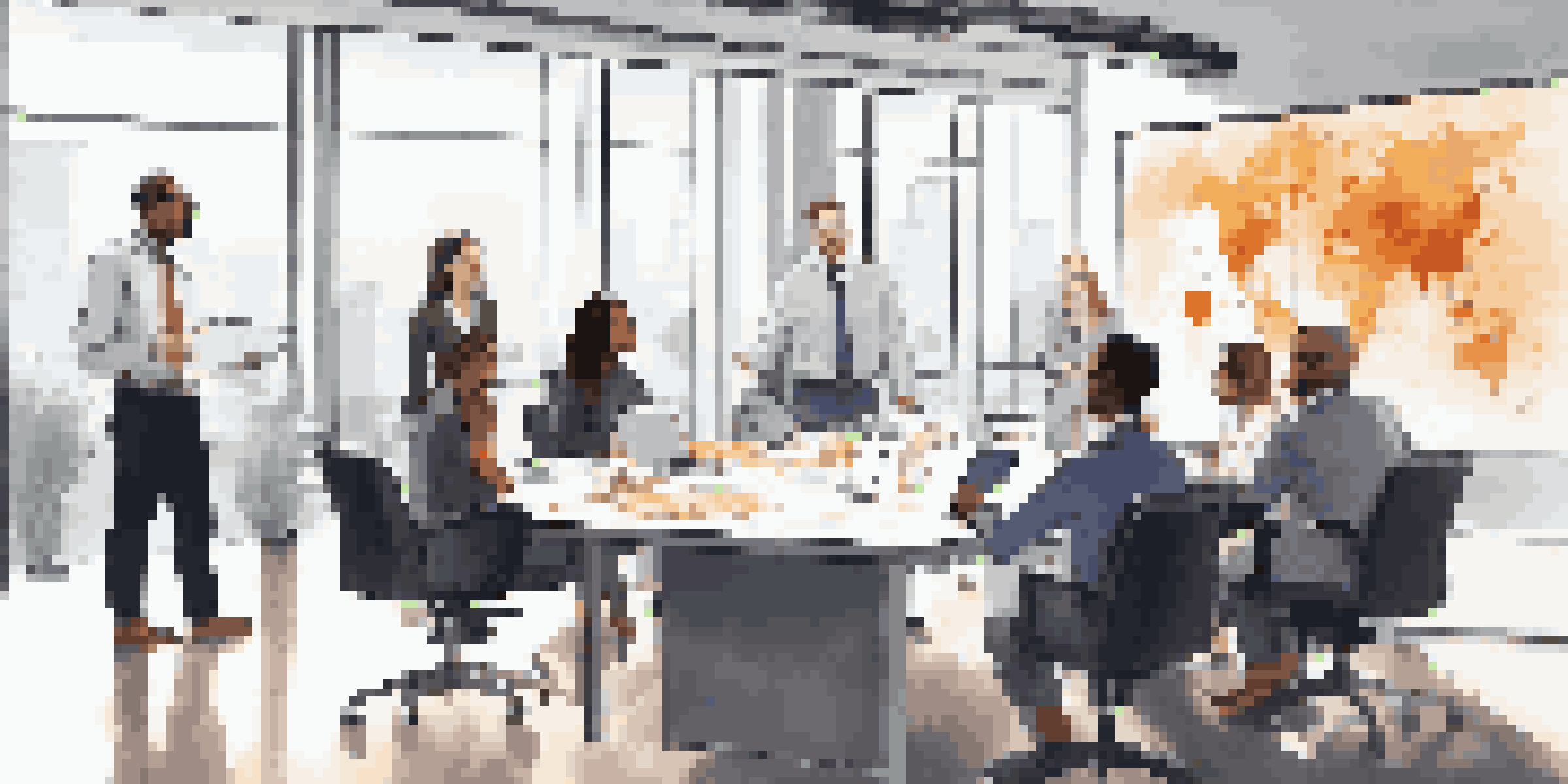 A diverse group of professionals collaborating in a modern office setting, showcasing teamwork and communication.